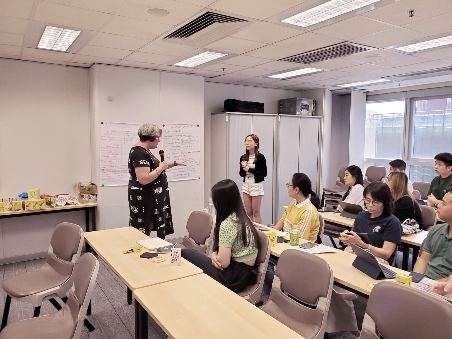 Clare Narrod lectures a group of students in Hong Kong.