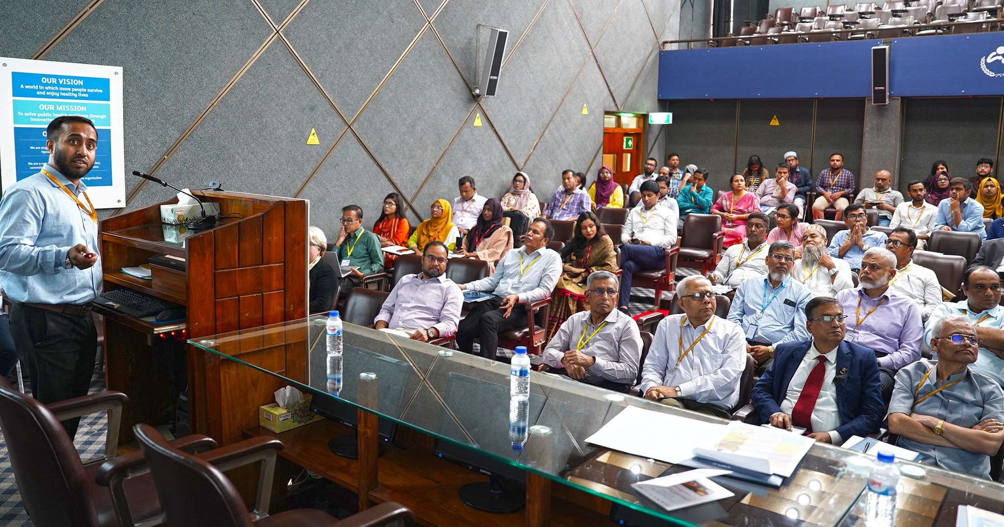 Photo of a speaker with the seminar audience.